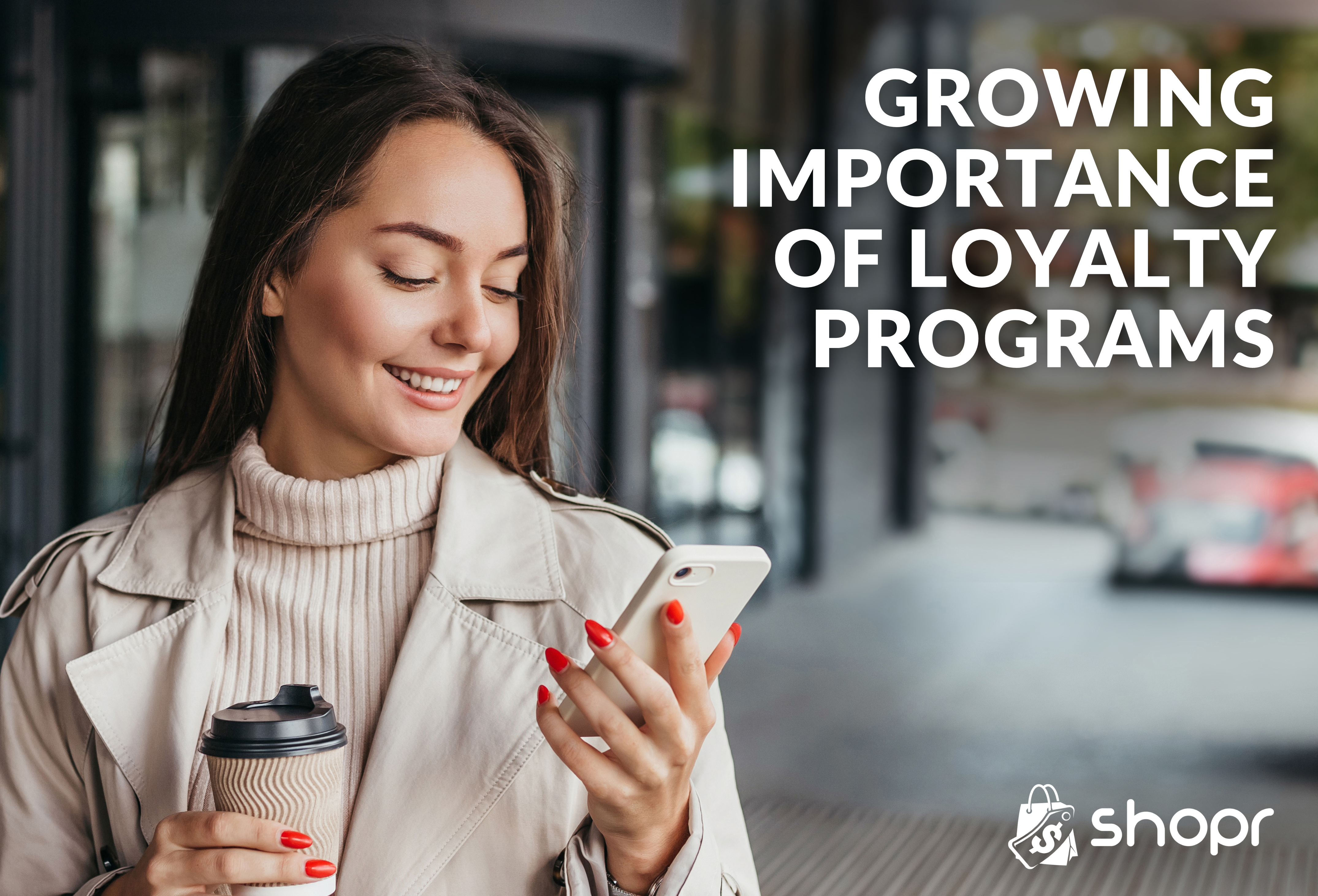 Woman with phone and coffee; growing importance of loyalty programs; shopr rewards